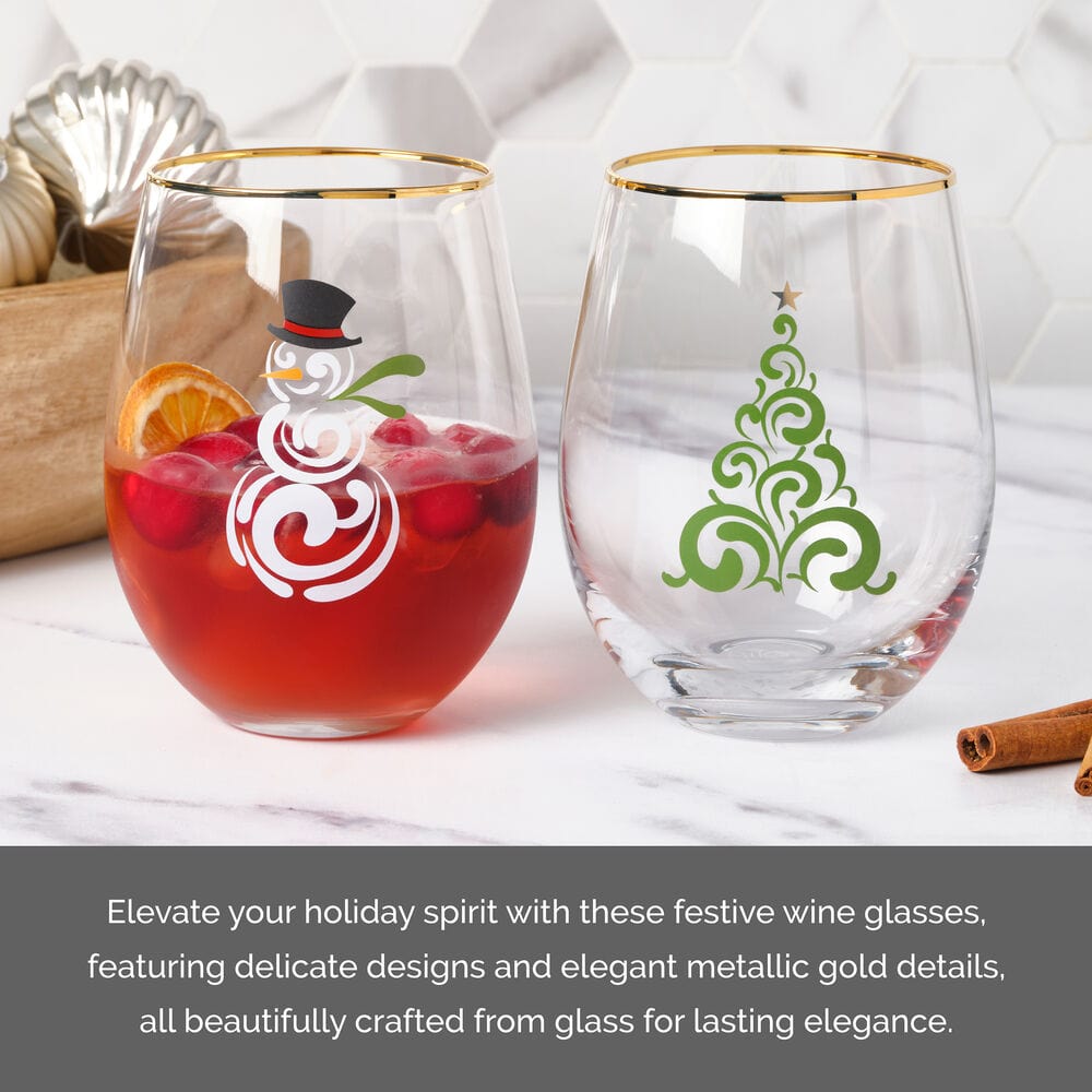 Two stemless wine glasses featuring a white snowman swirl and a green ornamental Christmas tree with gold rims