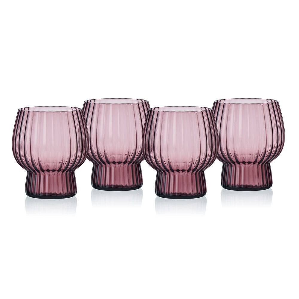 Set of four lilac Phoebe optic ribbed glasses lined up on white background