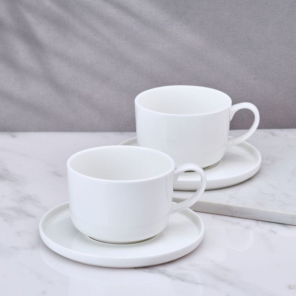 Samantha set of two white teacups with saucers on a marble surface