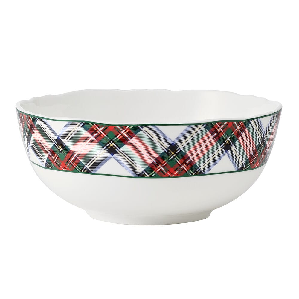 White scalloped edge bowl with a red green tartan plaid band around the exterior.