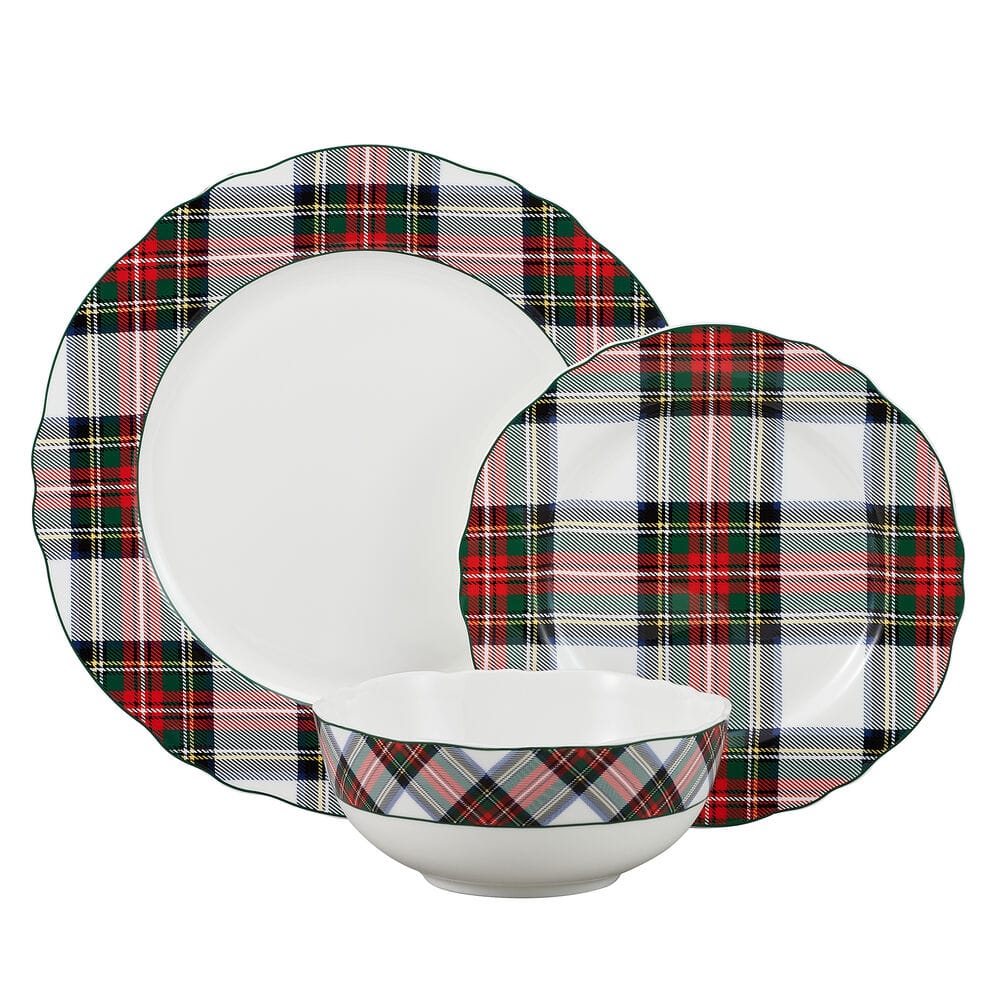 Tartan White scalloped dinnerware for four featuring plaid rim plates and bowls arranged on a wooden table.