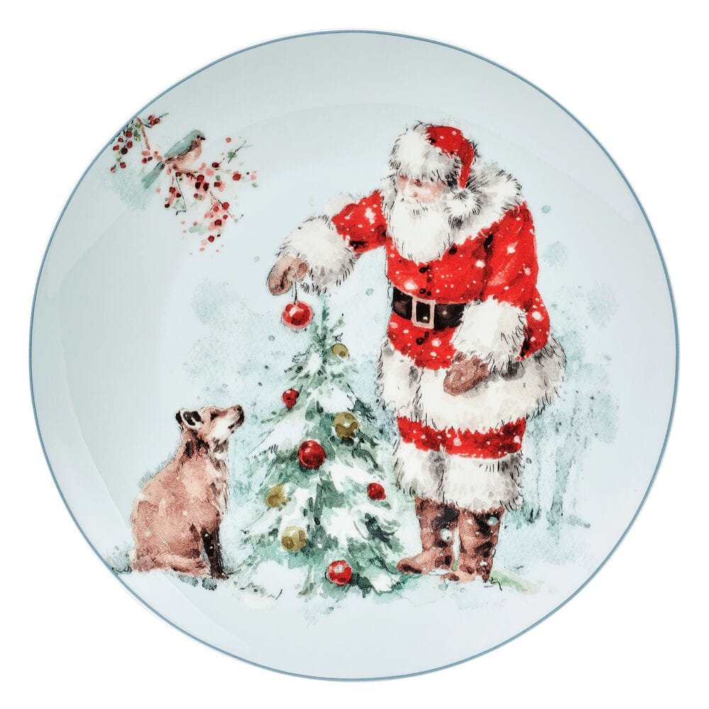 Plate from the Magical Santa set depicting Santa in a red suit near a decorated Christmas tree with a dog watching.