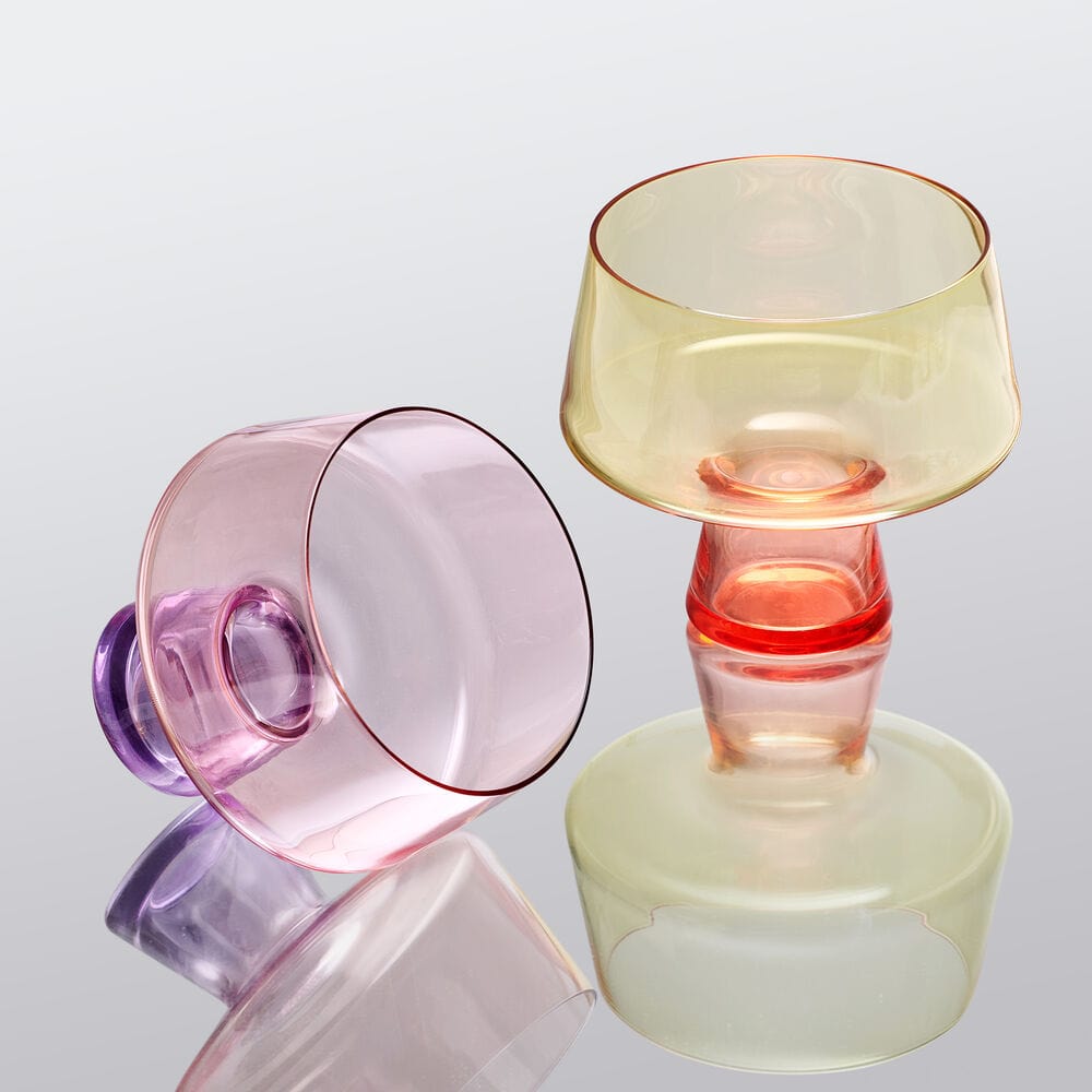 Chroma set of two pastel tinted martini glasses on a reflective surface