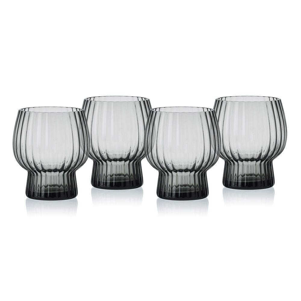 Four Phoebe Optic Smoke ribbed glasses lined up in a row
