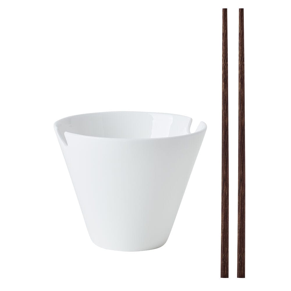 Two white noodle bowls with dark wooden chopsticks resting across them.