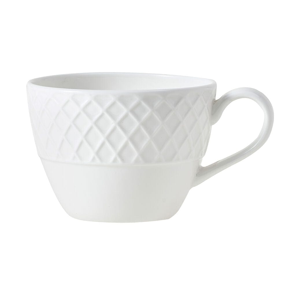 Side view of a white ceramic teacup with a diamond lattice texture and a curved handle