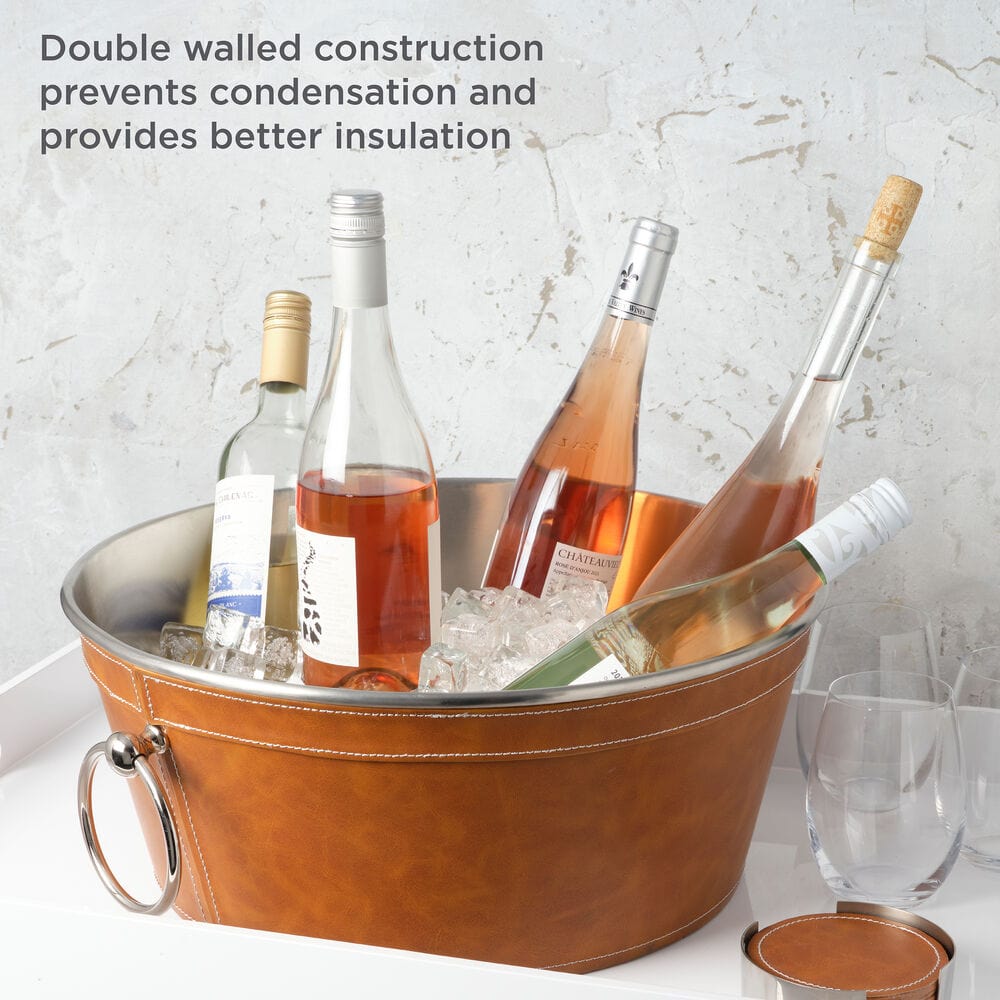 Faux leather beverage tub filled with wine bottles and ice on a white surface, demonstrating its double walled insulated design.