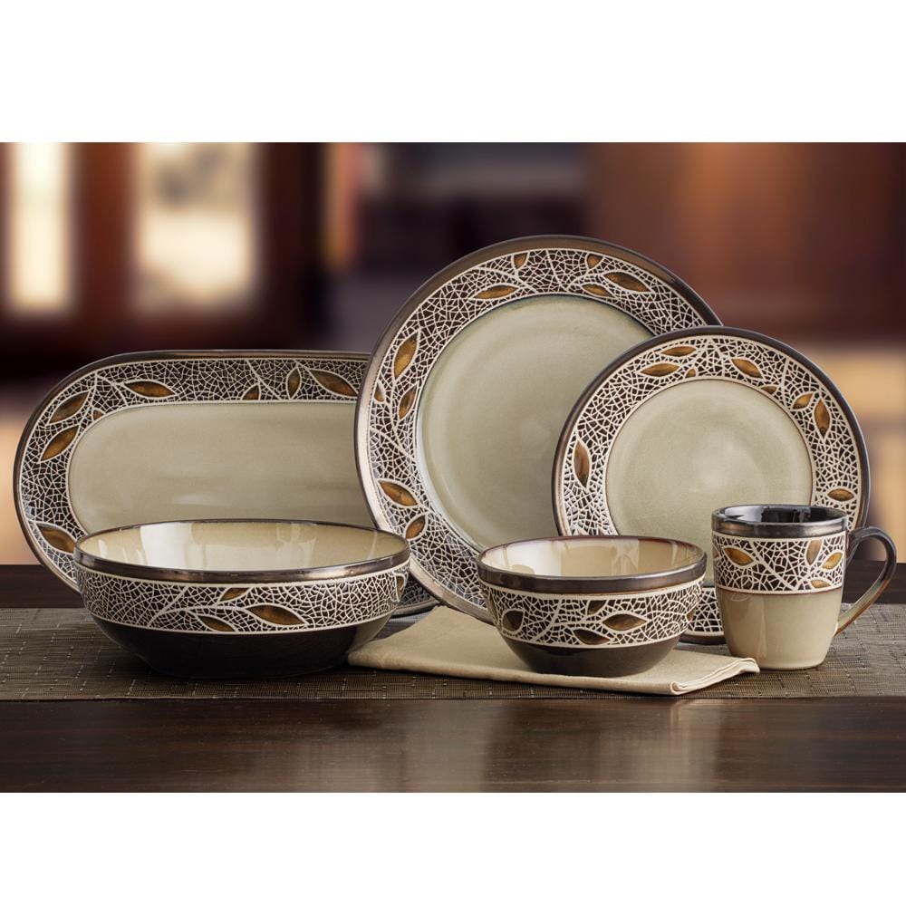 Close up of Alexandria bowls and plates featuring a lattice pattern with gold leaf accents along the rims.