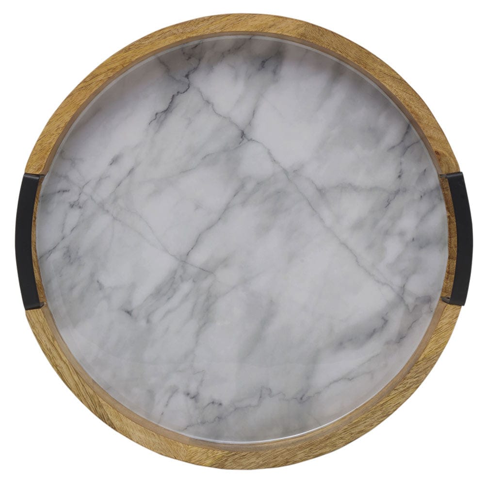Close up top view of a round marble Lazy Susan with a wood frame and black handles.