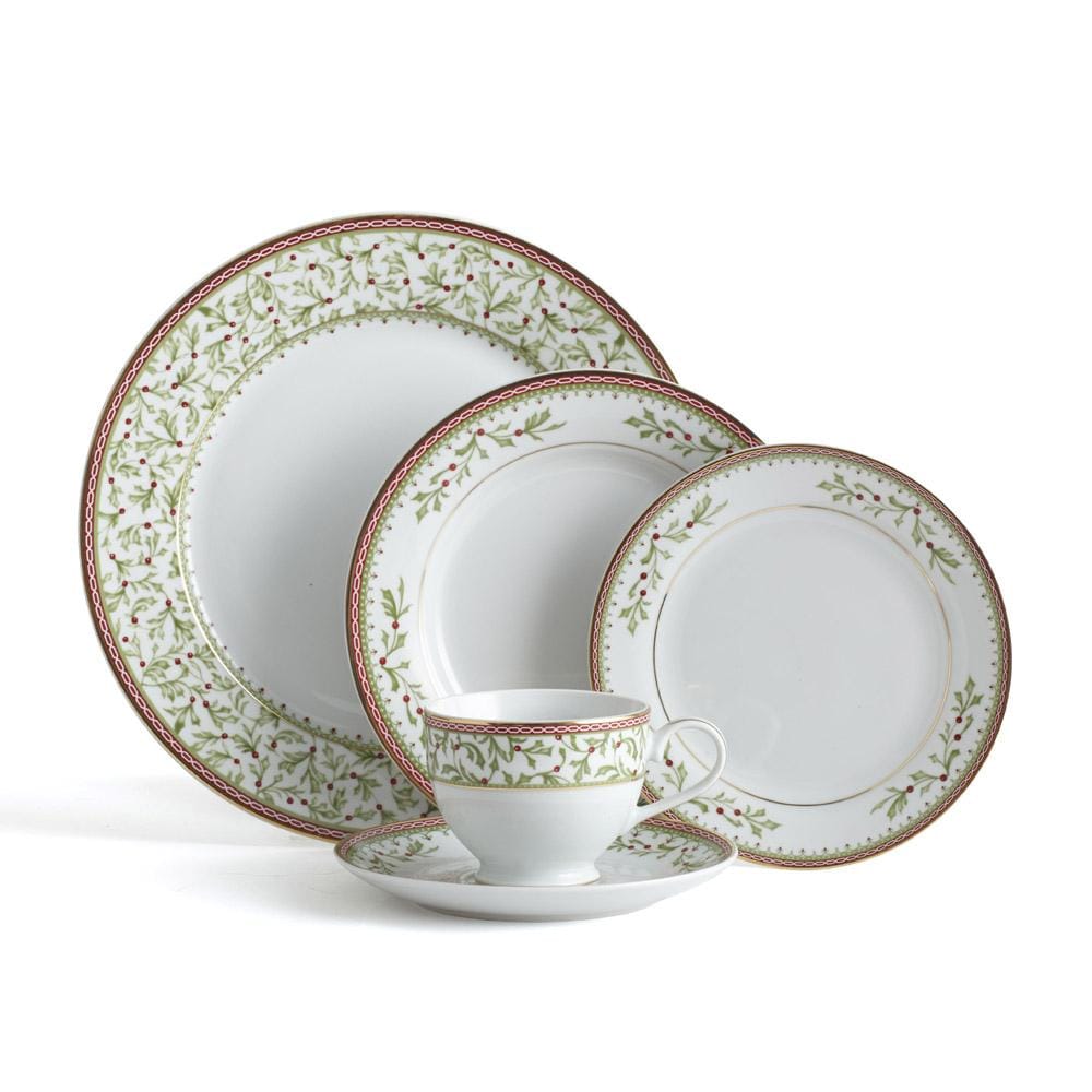 Holiday Traditions dinnerware set featuring holly border plates and matching cup and saucer