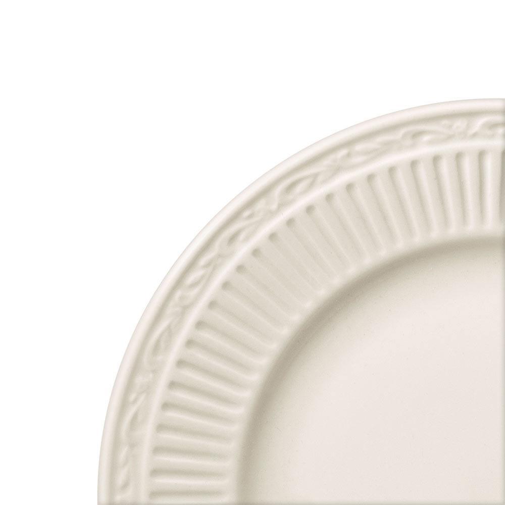 Close-up of a white salad plate with an embossed decorative rim from the Italian Countryside set