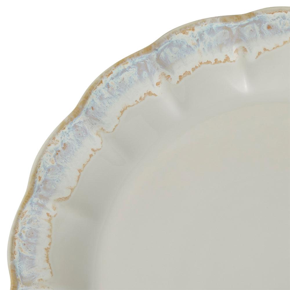 Close up of a Mila plate edge with a pale blue and beige distressed rim