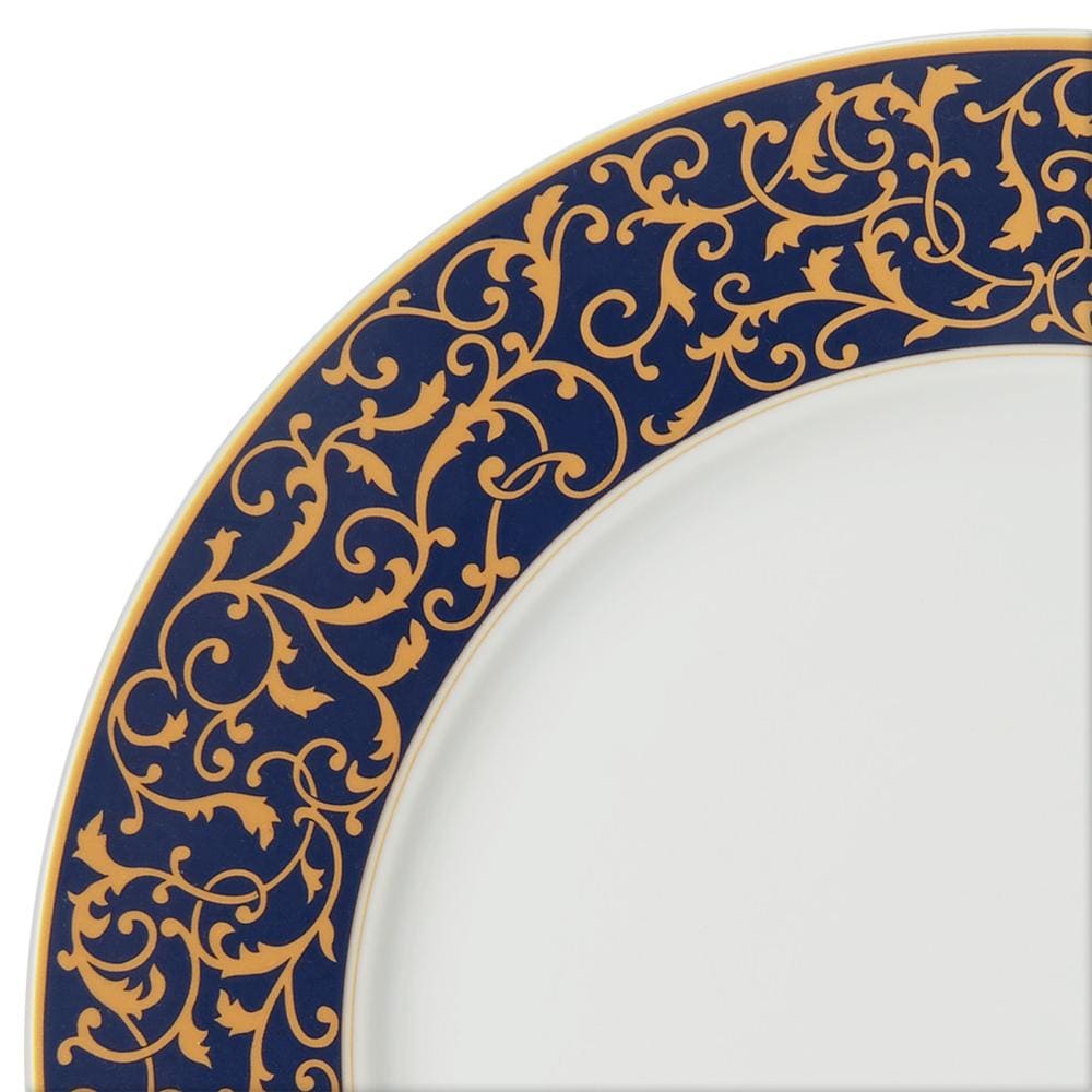 Close up of cobalt blue rim with gold filigree detailing along the edge.
