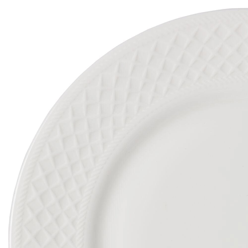 Close-up of a Patterson Vegan Bone dinner plate showing a textured diamond rim.