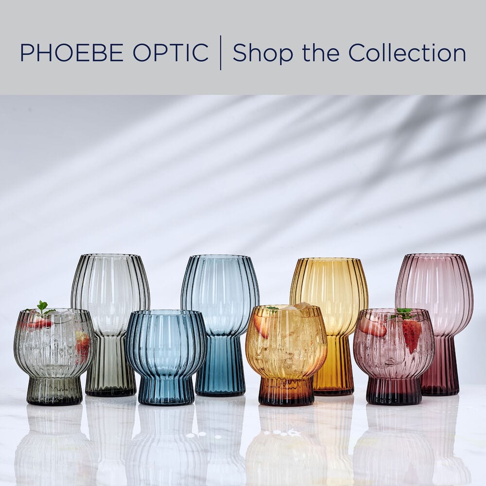 Phoebe ribbed glass collection for double old fashioned glasses in blue amber and pink hues on a light background.