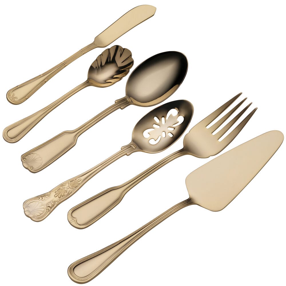 Gold plated Towle Hotel flatware pieces arranged diagonally on a white background