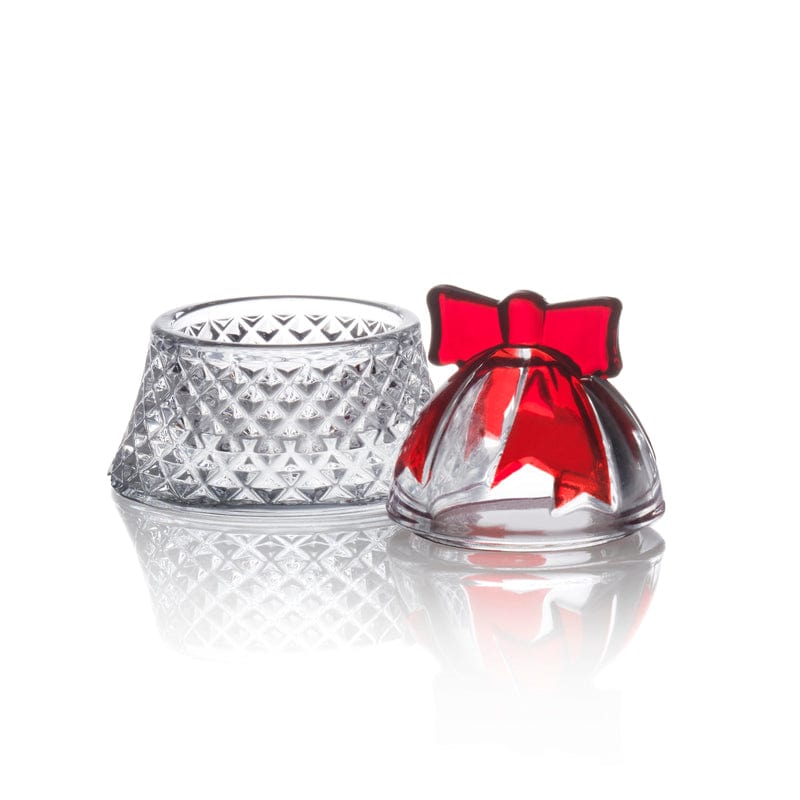 Crystal ruby bell covered box with red bow beside a diamond-cut crystal base