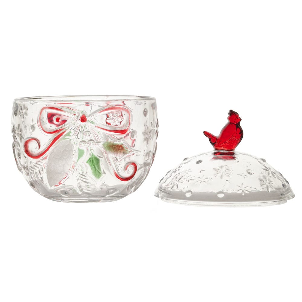 Clear glass candy box with etched floral and bow motifs and a lid topped by a red cardinal finial.