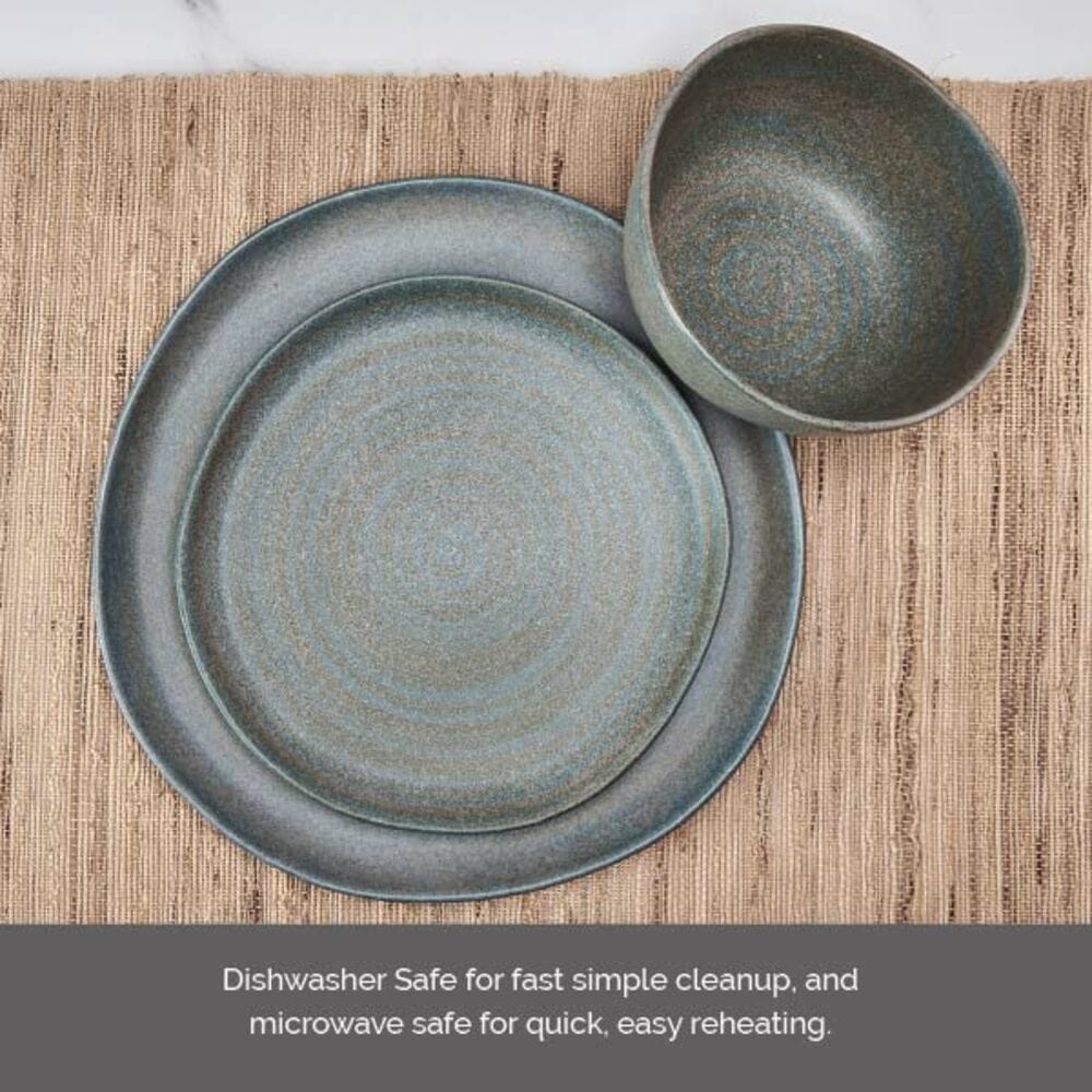 Blue gray speckled stoneware dinnerware set for four with a large plate and a bowl on a woven mat