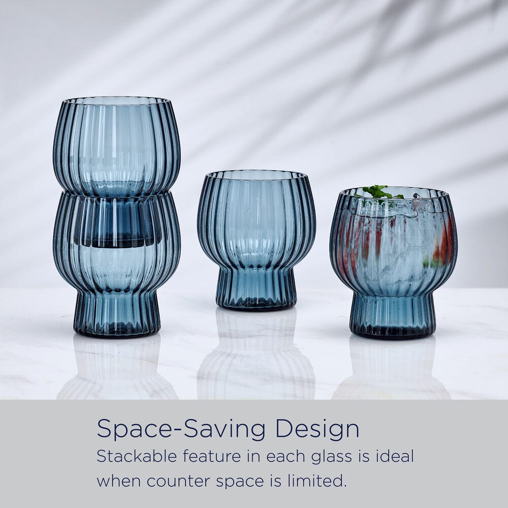 Phoebe optic blue ribbed double old fashioned glasses set of four on a white reflective surface.