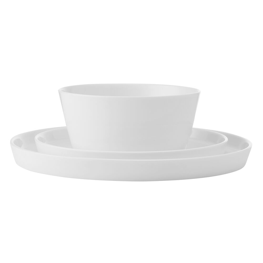 Stacked white dinnerware with a bowl on top of a large plate from the Rylee set