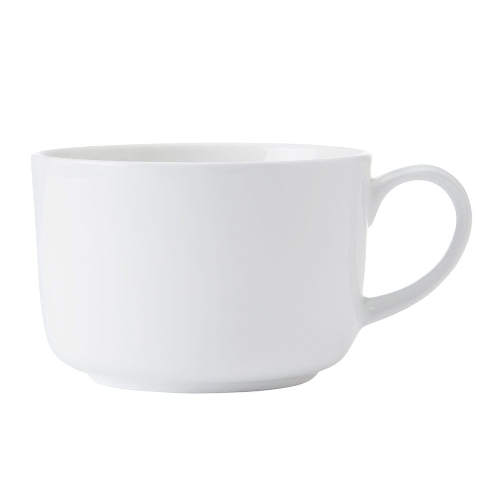 White ceramic teacup with handle on a clean white background