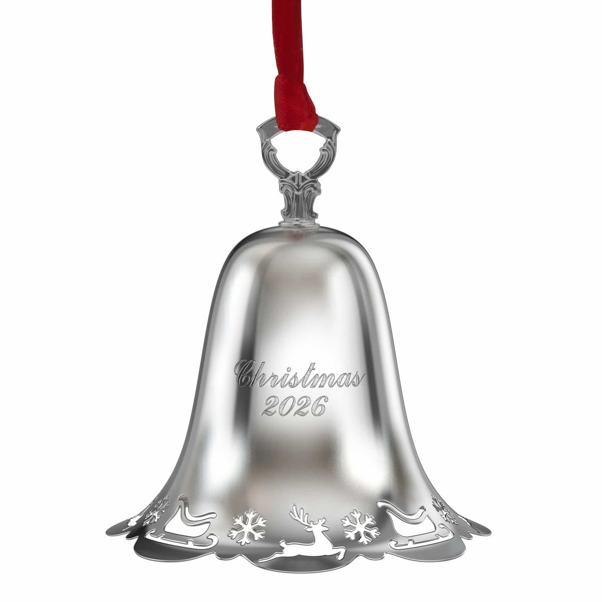 Close up of a silver pierced bell ornament with a red ribbon threaded through the hanging loop.