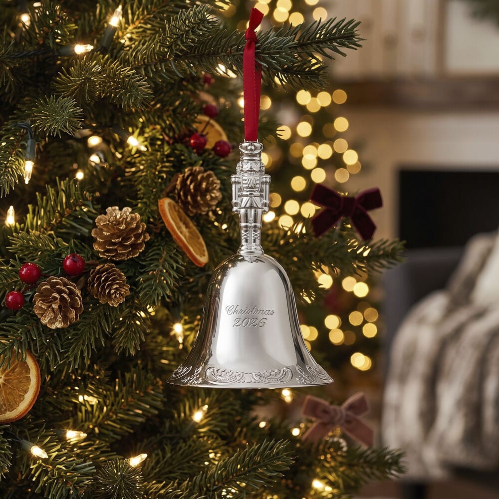 Wallace Grande Baroque 2026 Silver Plated Nutcracker Bell Ornament 32nd Edition hanging on a Christmas tree