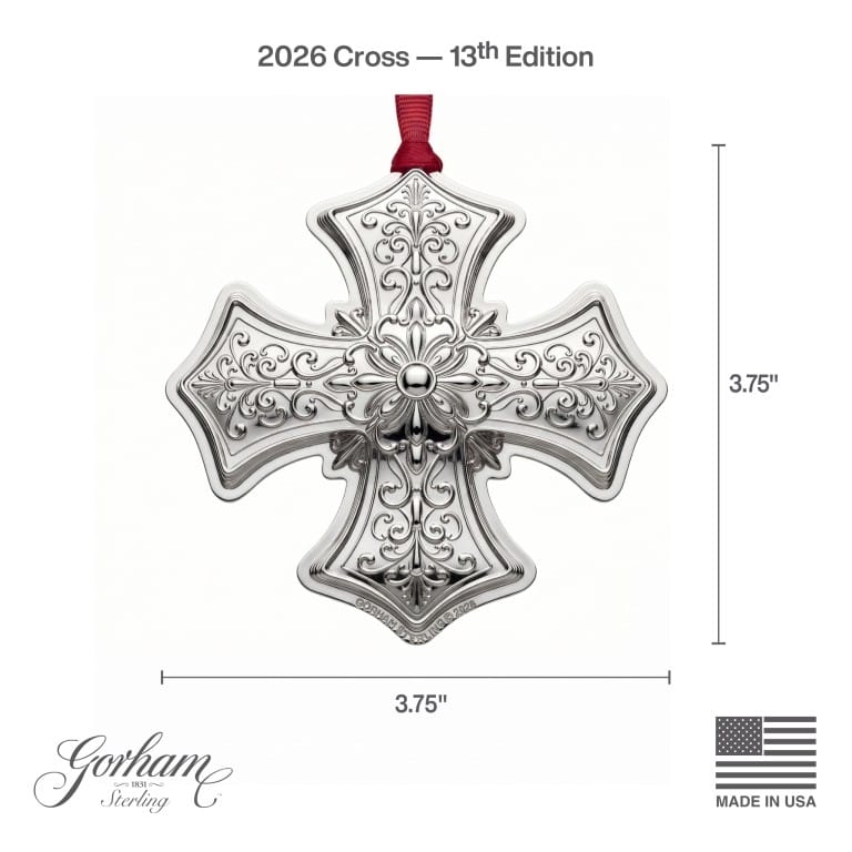 Intricately engraved sterling silver cross ornament from Gorham 2026 13th Edition with a red hanging ribbon