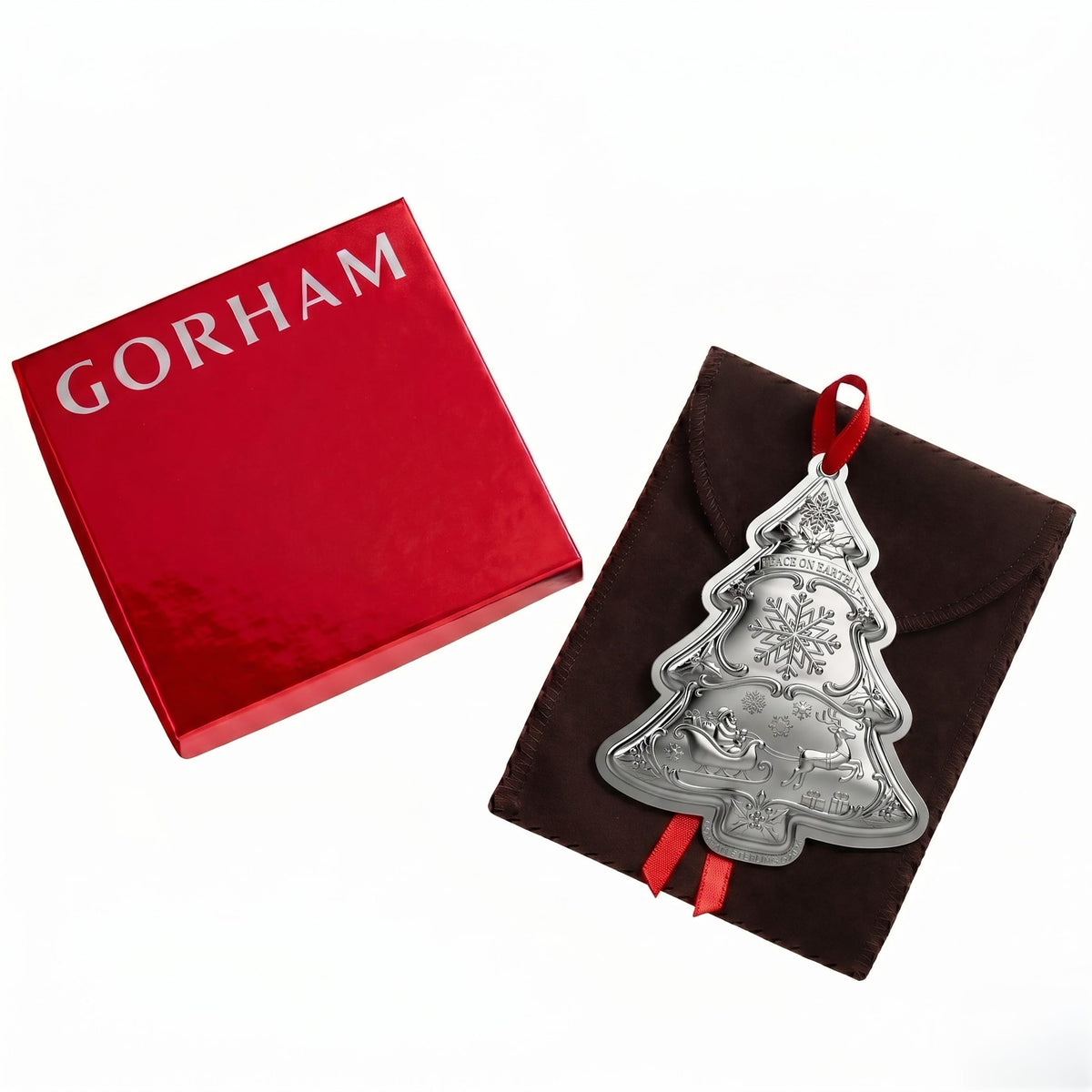 Gorham red gift box with white logo beside a brown leather gift pouch and a hanging silver ornament