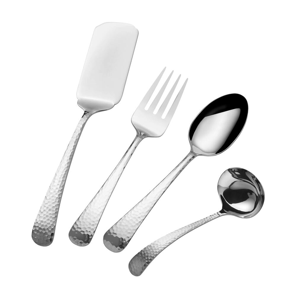 Hammered silver flatware including a cake server forks knives and spoons arranged on a white background