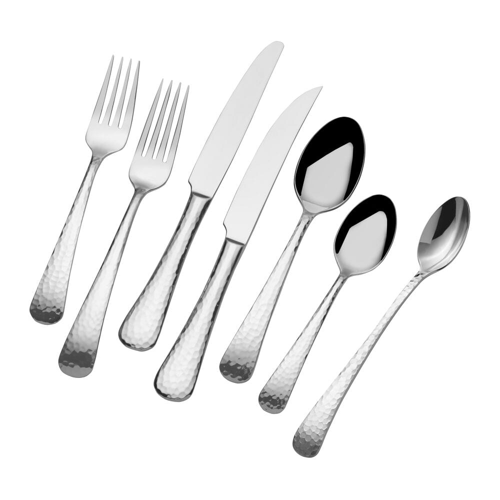 Hammered silver flatware for 12 forks knives and spoons arranged diagonally