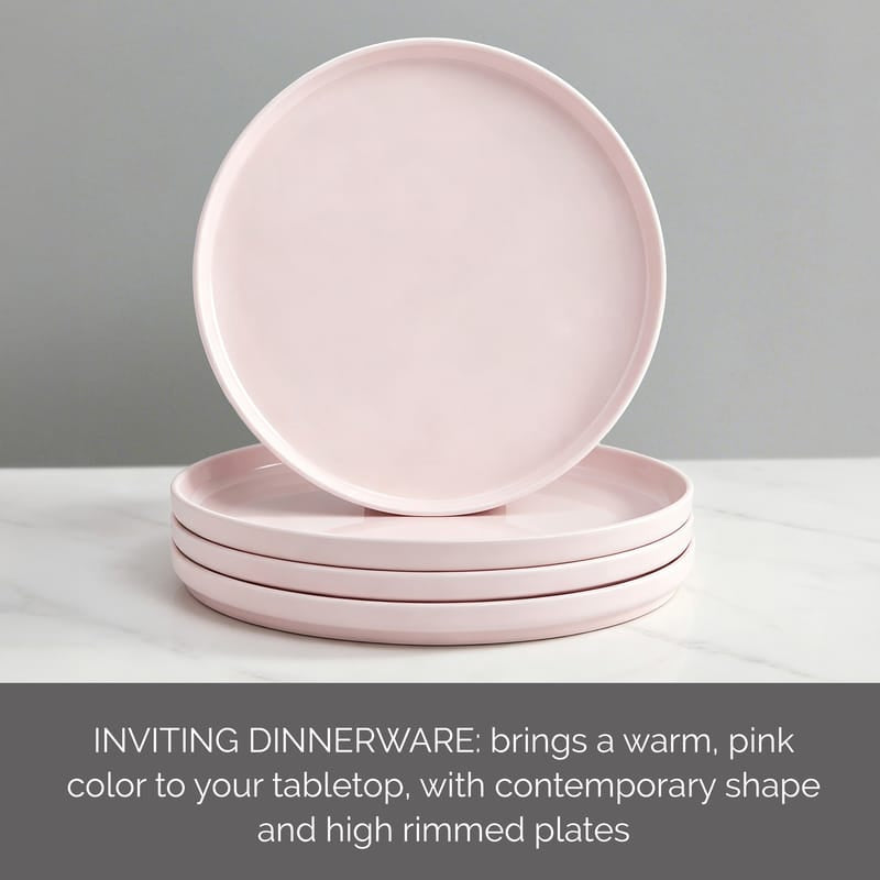 Single Madison Pink dinner plate standing on edge beside a stack of plates on a marble surface