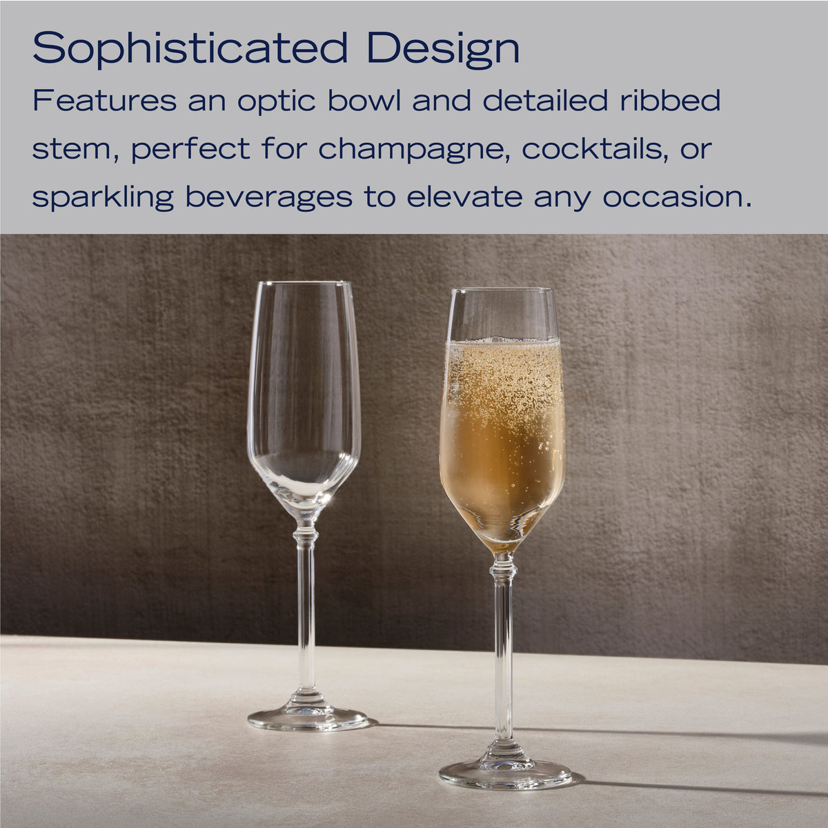 Two Eloise champagne flutes with ribbed stems and optic bowls, one filled with champagne.