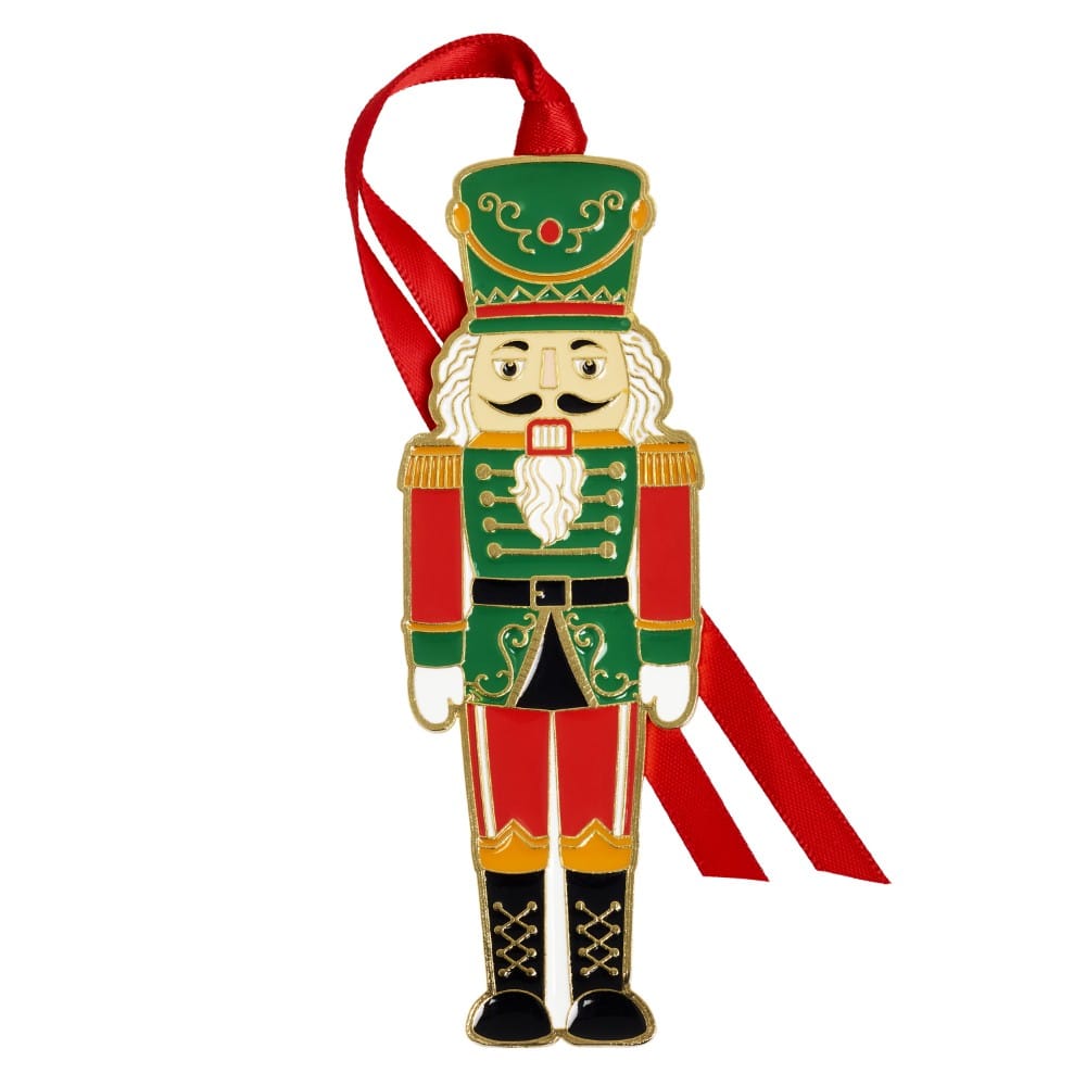 Gold plated enameled nutcracker ornament wearing a green and red military uniform with a white beard and red hanging ribbon