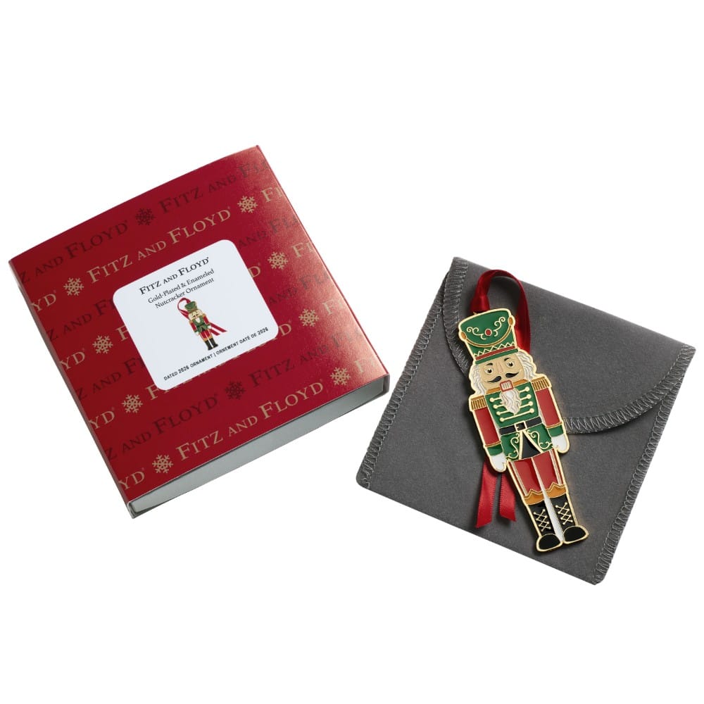 Fitz and Floyd 2026 nutcracker ornament displayed with red gift box and gray pouch