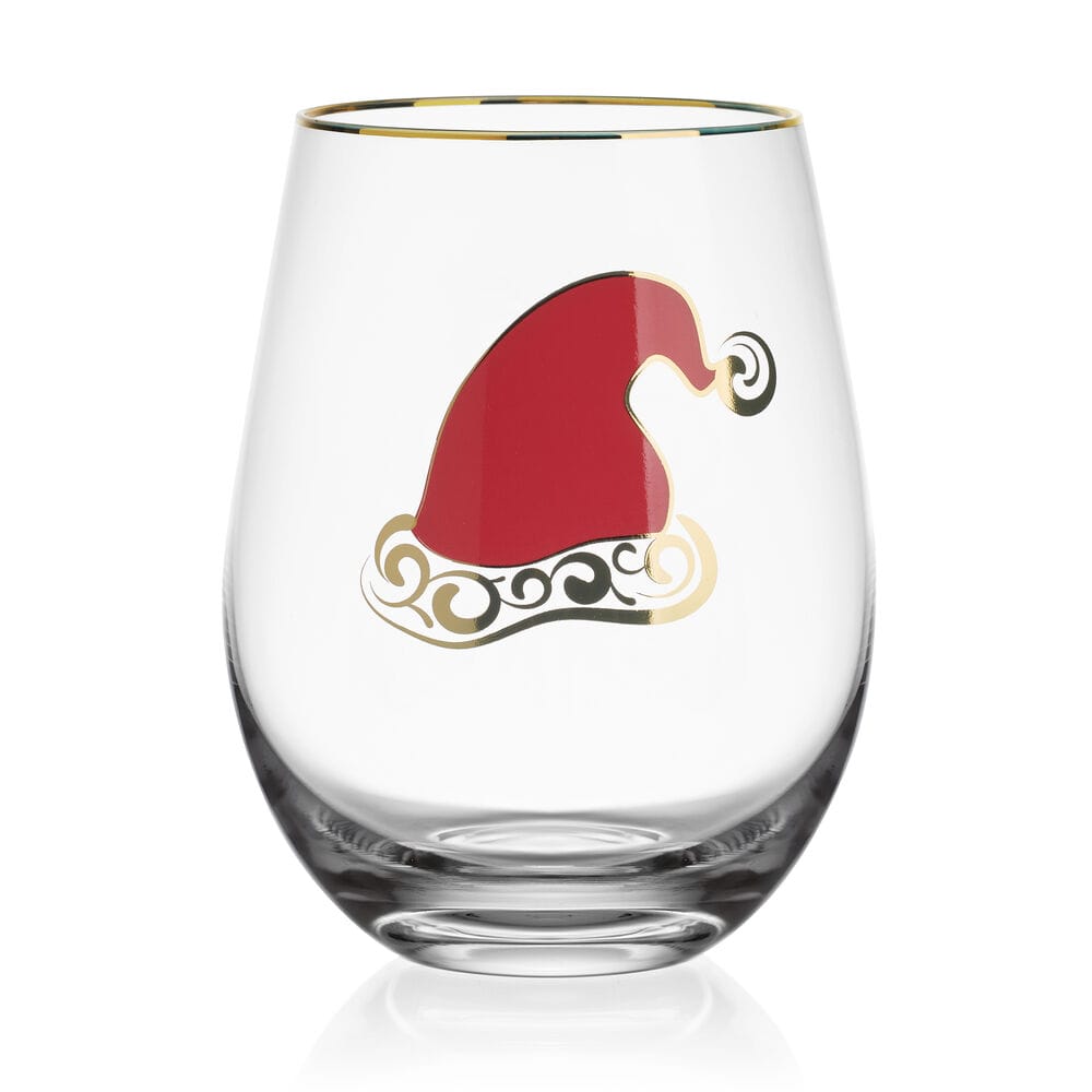 A clear stemless wine glass with a gold rim, featuring a red Santa hat design with gold and black scroll details on the front, set against a plain white background.