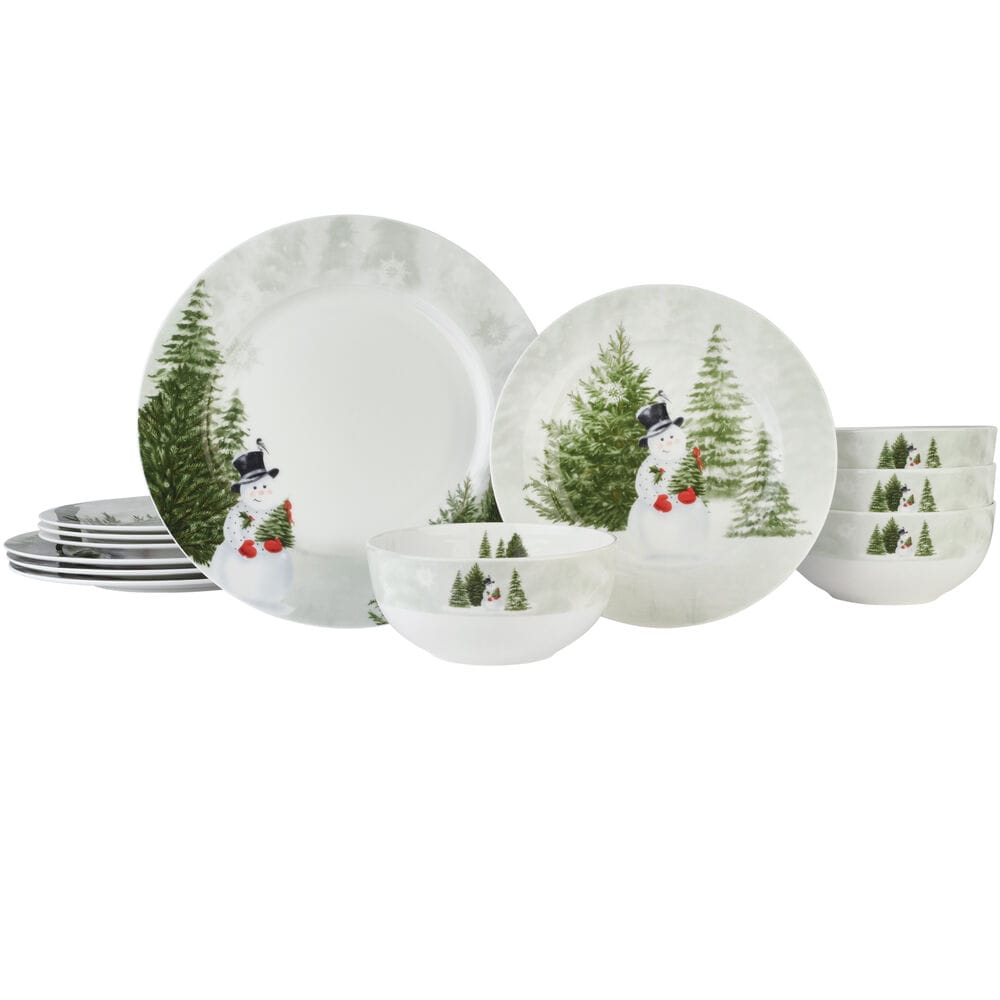 Snowmans Winter 12 piece dinnerware set for four with plates and bowls decorated with a snowman and evergreen trees