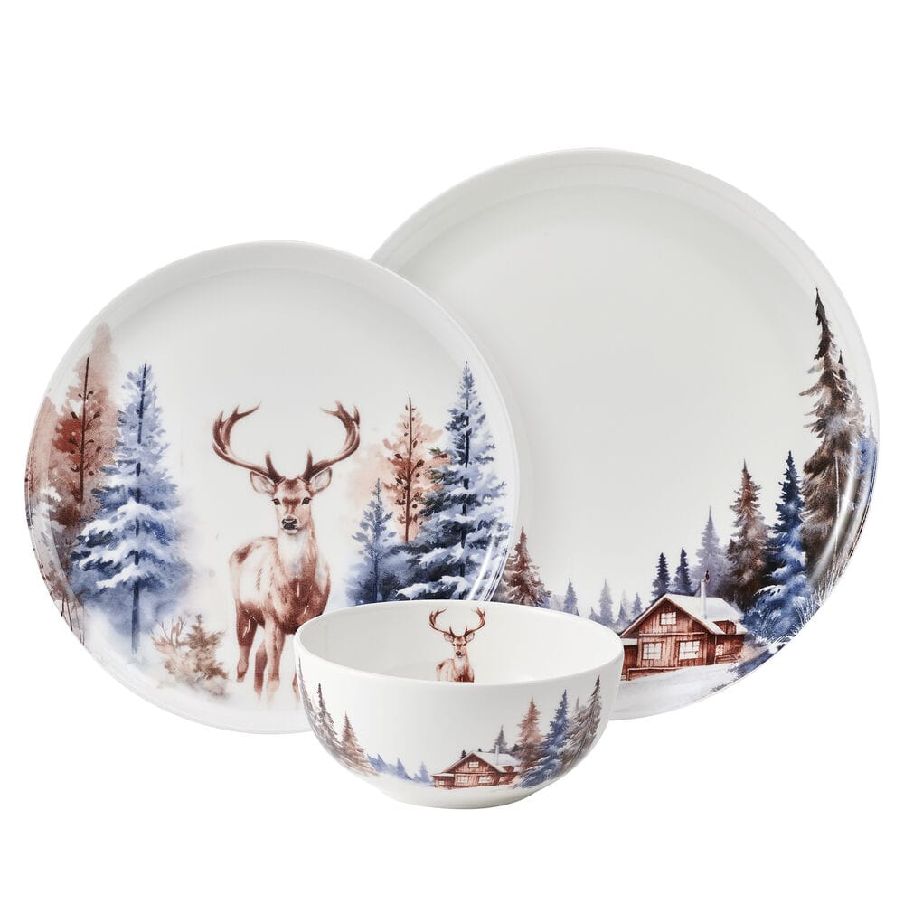Whispering Pines 12 piece dinnerware set for four with deer and snowy forest motifs on plates and bowls