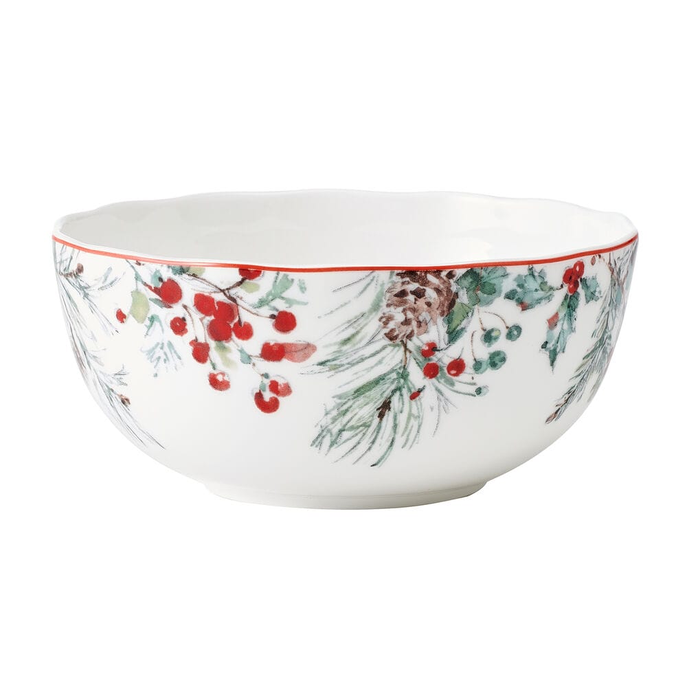Pine and Berry white ceramic bowl with a red rim and festive pine and berry pattern.