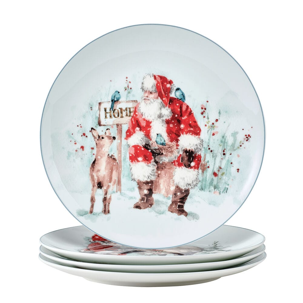 Santa in red with a deer beside a HOME sign and blue birds in a snowy scene on a decorative salad plate.