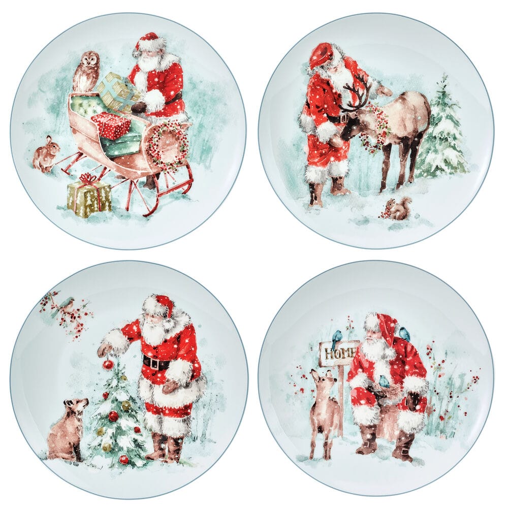 Four round salad plates decorated with Santa Claus and winter scenes