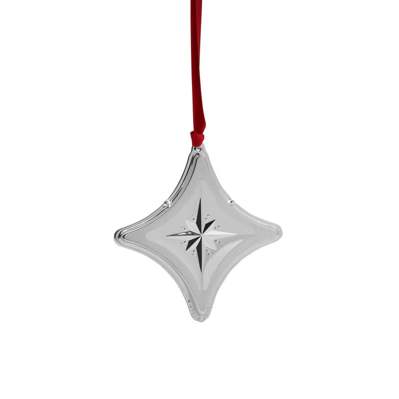 Shiny silver diamond-shaped star ornament with a red ribbon hanging against a white background.