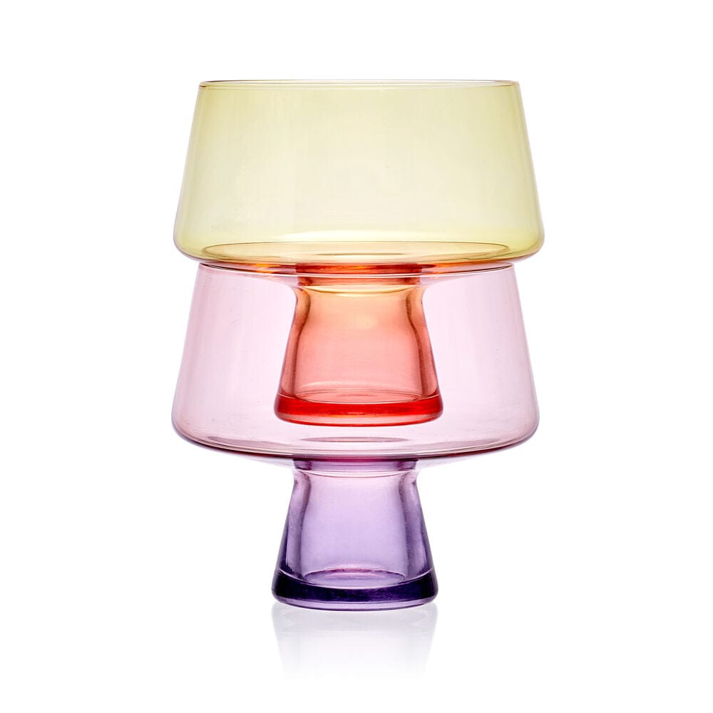 Close up of a chroma martini glass showing a pale yellow bowl and purple base.