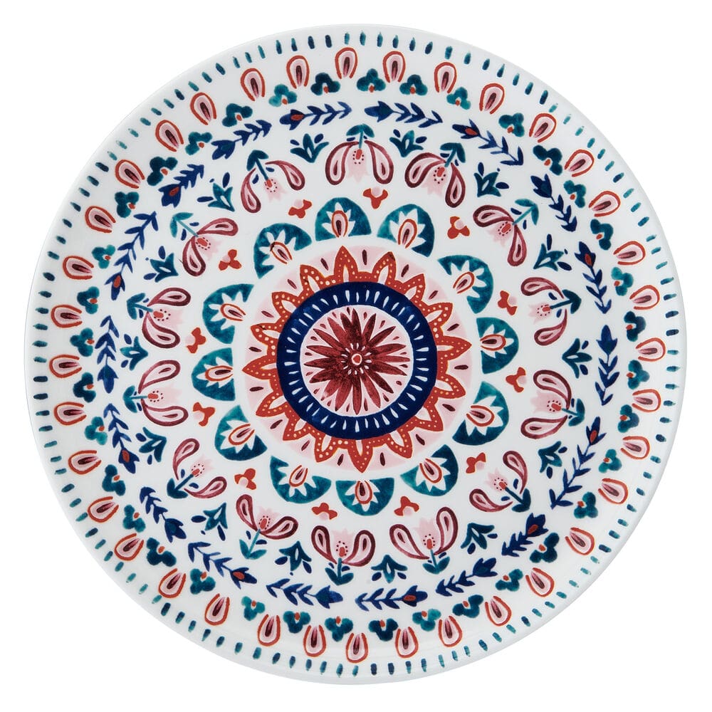 Salad plate with a circular multicolor medallion in blue red teal and pink on a white background