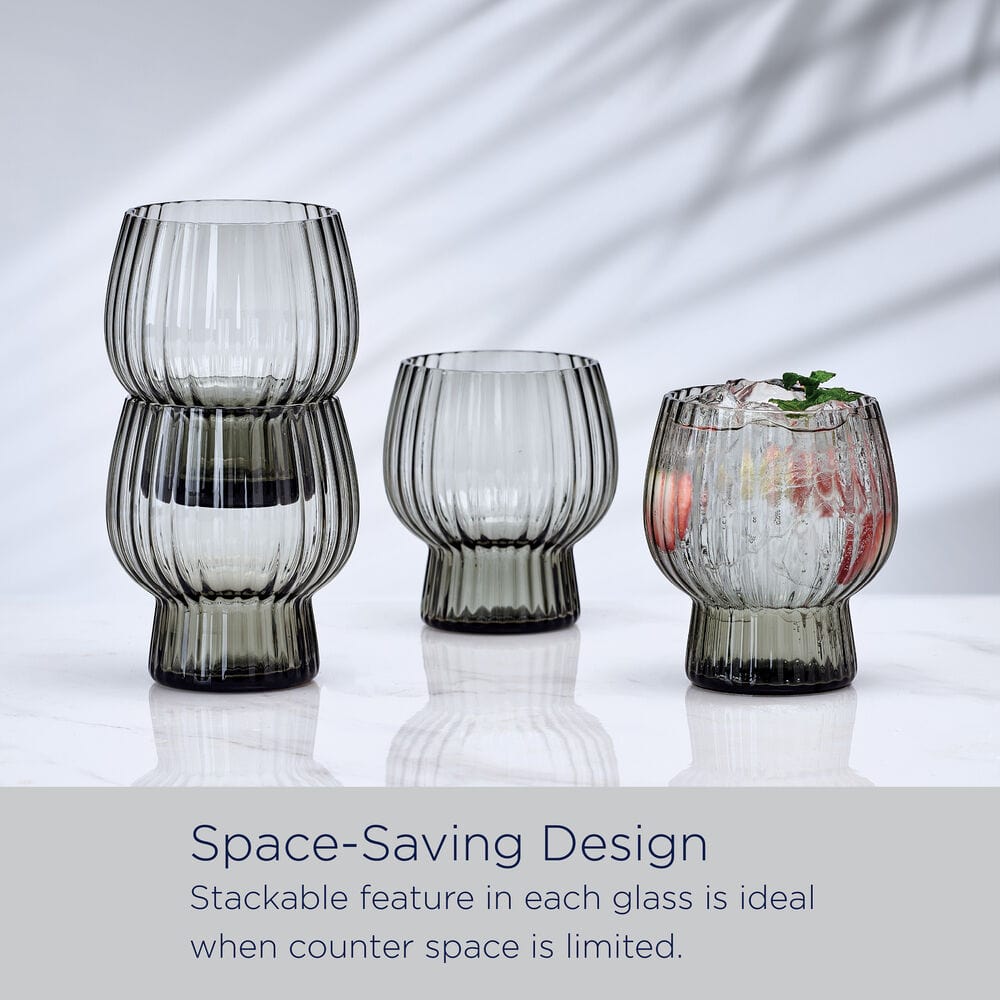 Phoebe Optic Smoke set of four ribbed glasses displayed on a white surface with a gray space saving design caption.