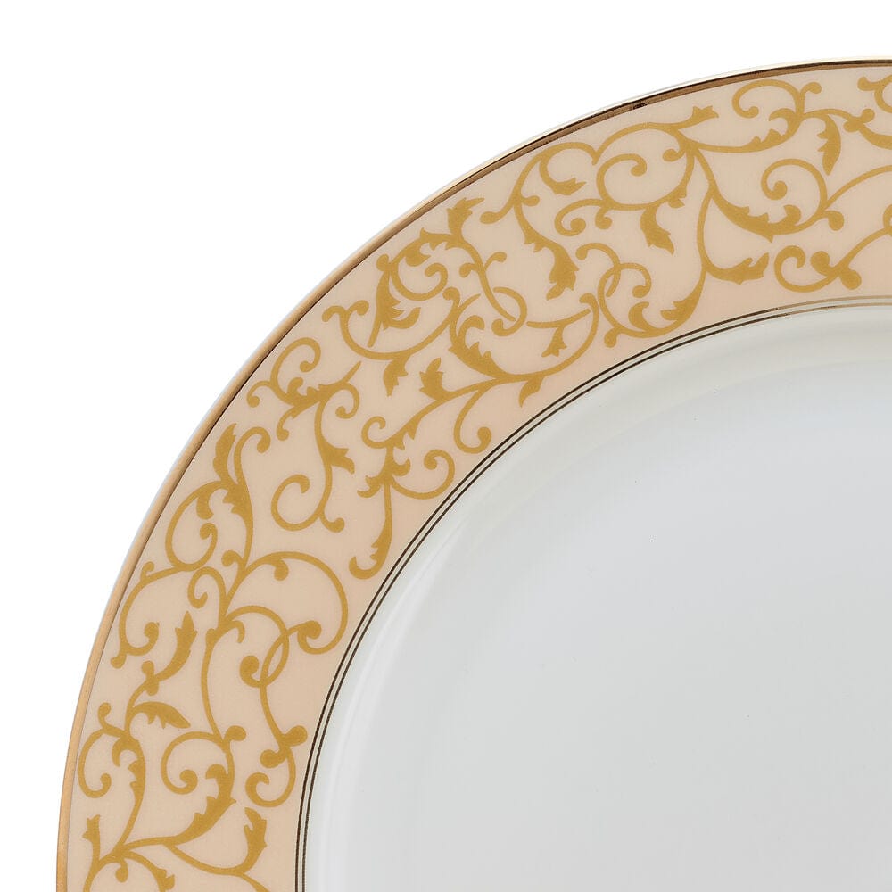 Close-up of the parchment gold patterned rim on a dinner plate.