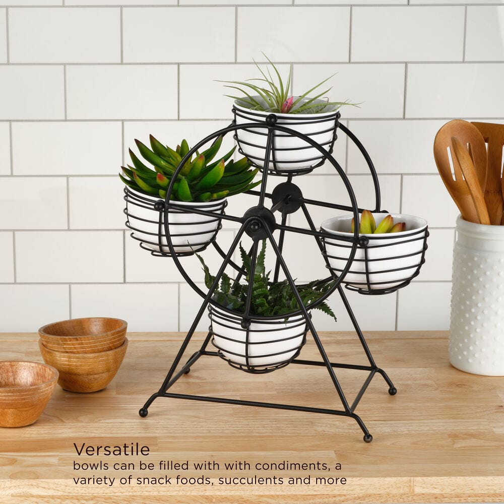 Ferris wheel wire caddy used as a plant display with white bowls holding succulents on a kitchen counter.