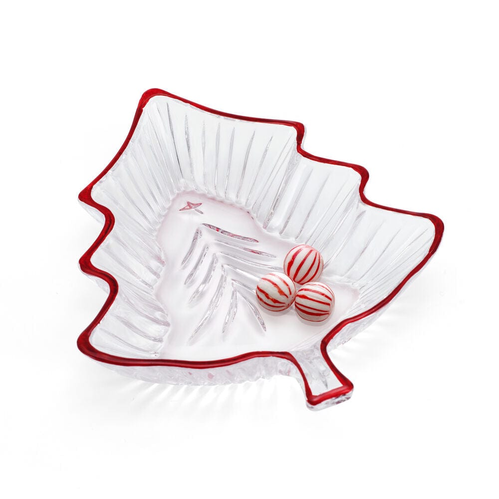 Clear leaf shaped candy dish with a red rim holding three red striped candies