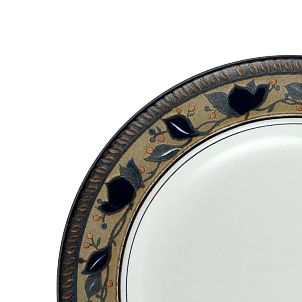 Close-up of the Arabella salad plate rim with blue floral motif and decorative border.